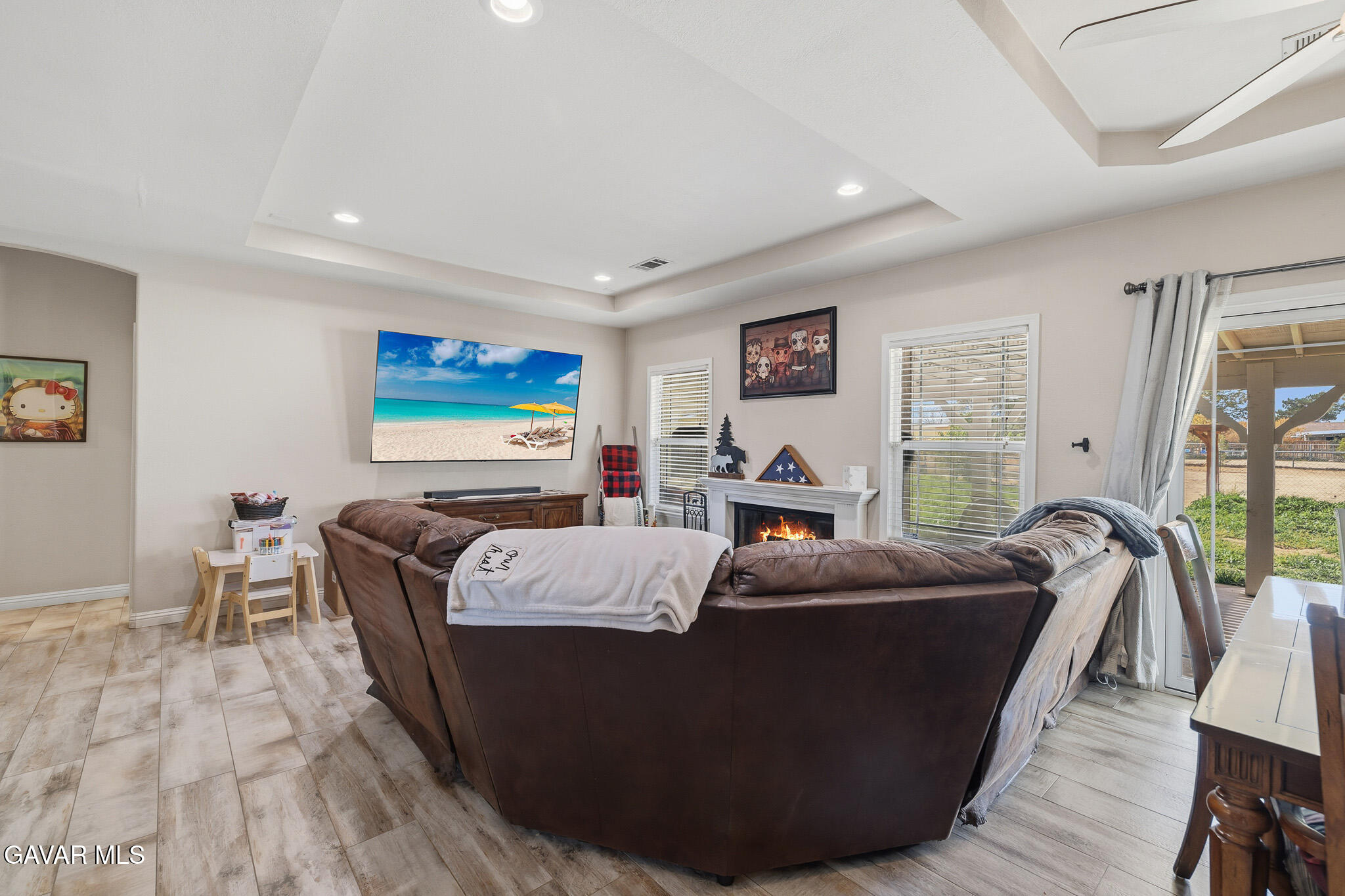 49945 80th Street West Lancaster, CA 93536 - Photo 7 of 38 a living room with furniture and a flat screen tv