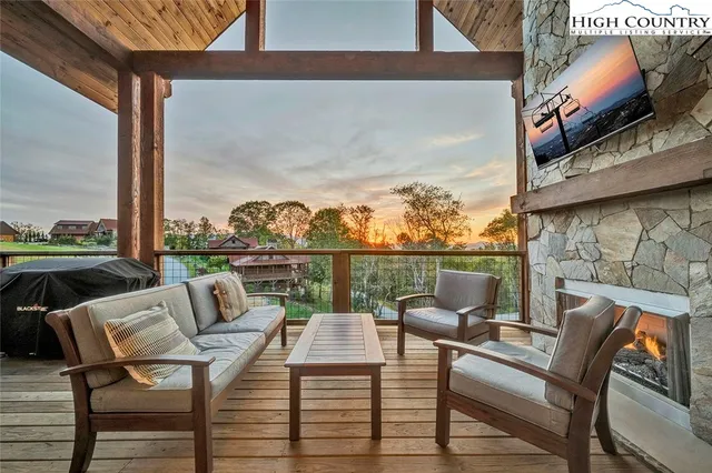 a balcony view with a seating space