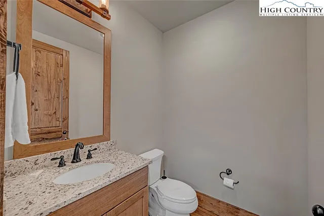 a view of balcony with wooden floor and outdoor seating