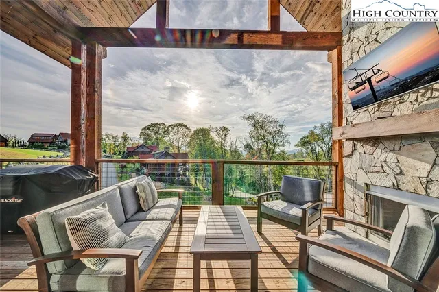 a building outdoor space with patio furniture and potted plants