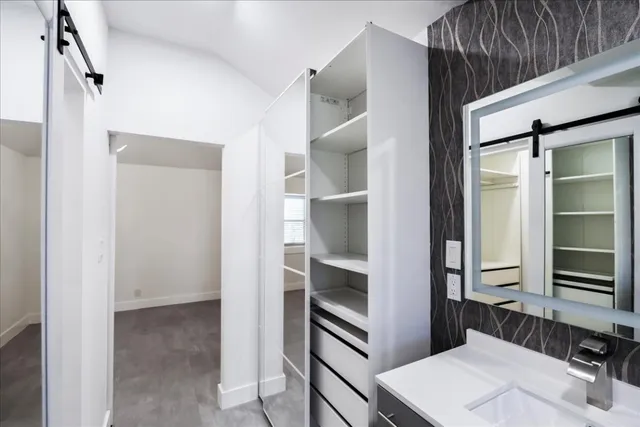 a kitchen with a refrigerator and a sink