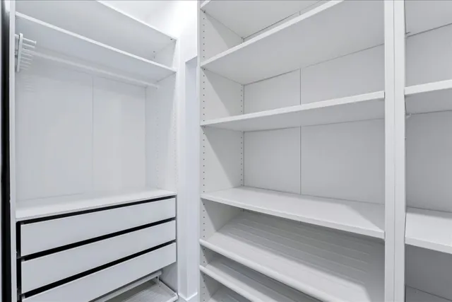 a view of an empty walk in closet