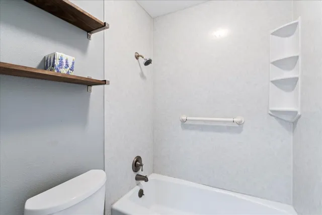 a bathroom with a toilet and a sink