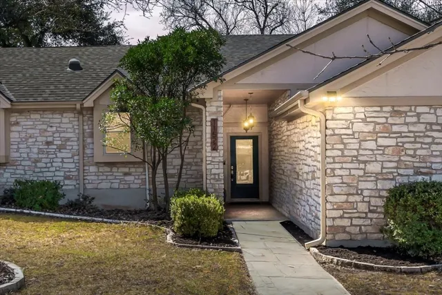 a view of a pathway both side of house