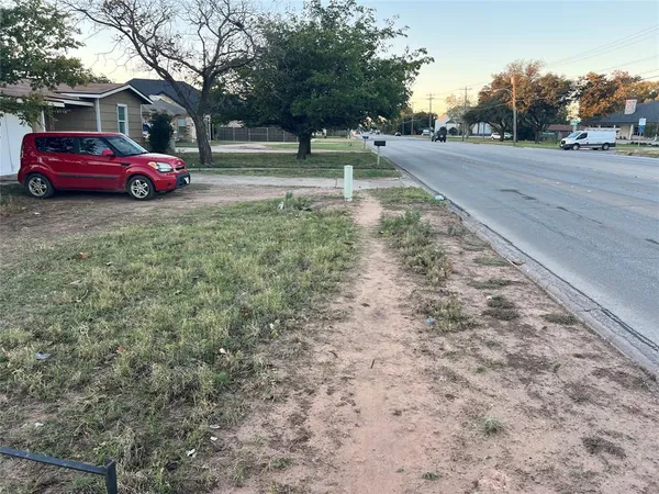 a view of a yard with a trampoline