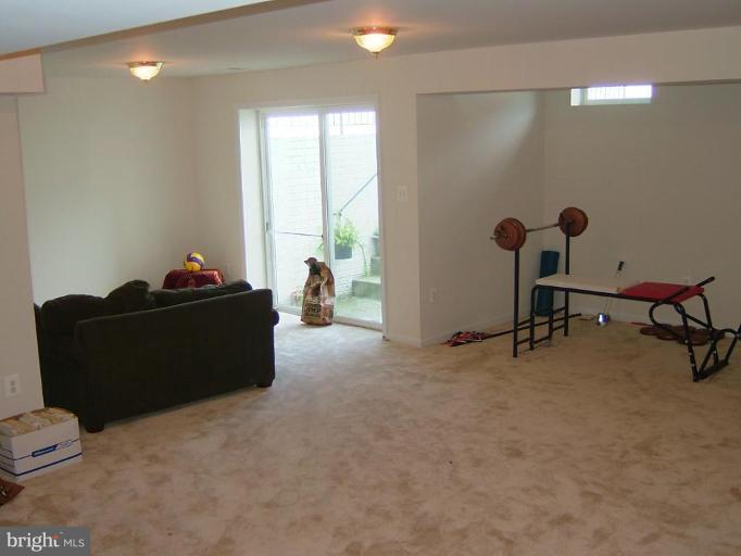 7522 Roxy Drive Windsor Mill, MD 21244 - Photo 18 of 21 Huge finished Basement with Sliders to Wide Stairs