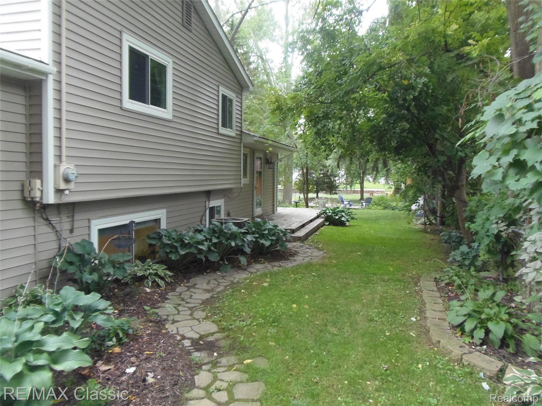 5111 Reymont Road Waterford, MI 48327 - Photo 4 of 47 Stone pathway filled with Hostas.JPG