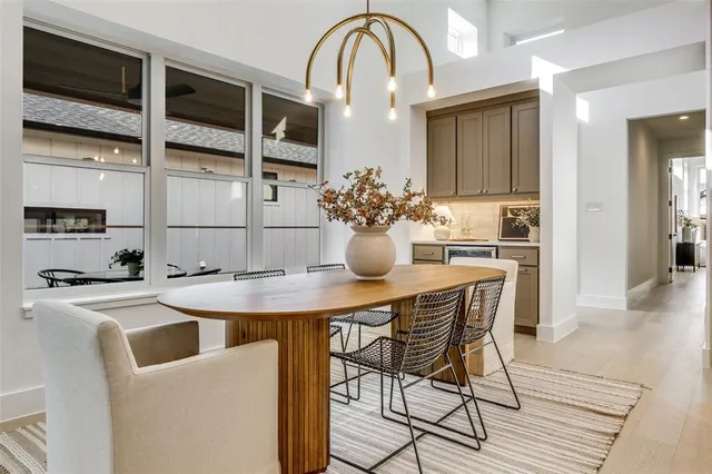 a large kitchen with a table and chairs