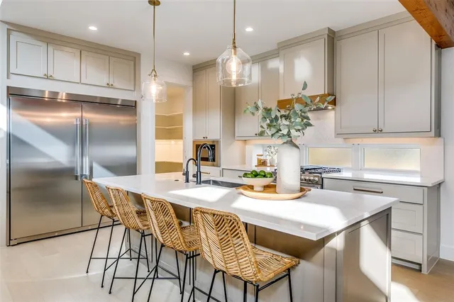 a kitchen with a table and chairs