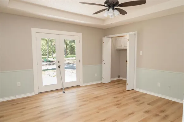 a view of an empty room with a window