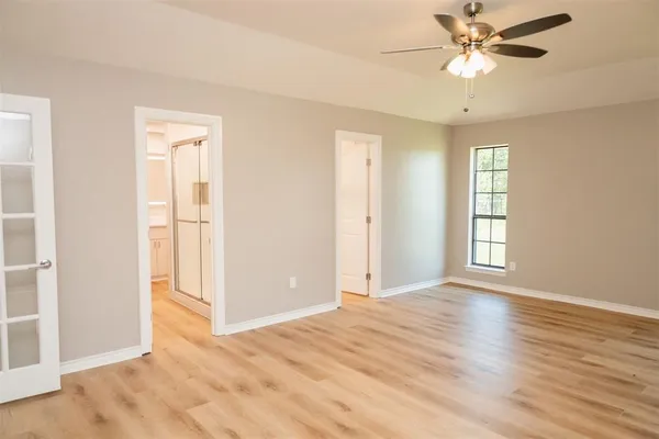 a view of an empty room with a window