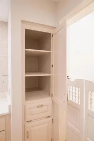 a view of walk in closet with empty racks