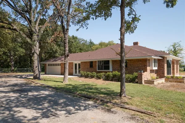 a front view of a house with a garage