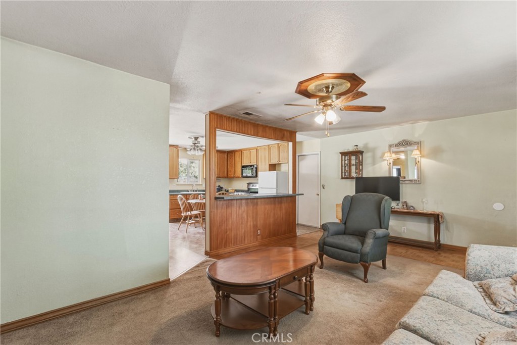 6812 Helton Street Winton, CA 95388 - Photo 6 of 24 a living room with furniture and a window