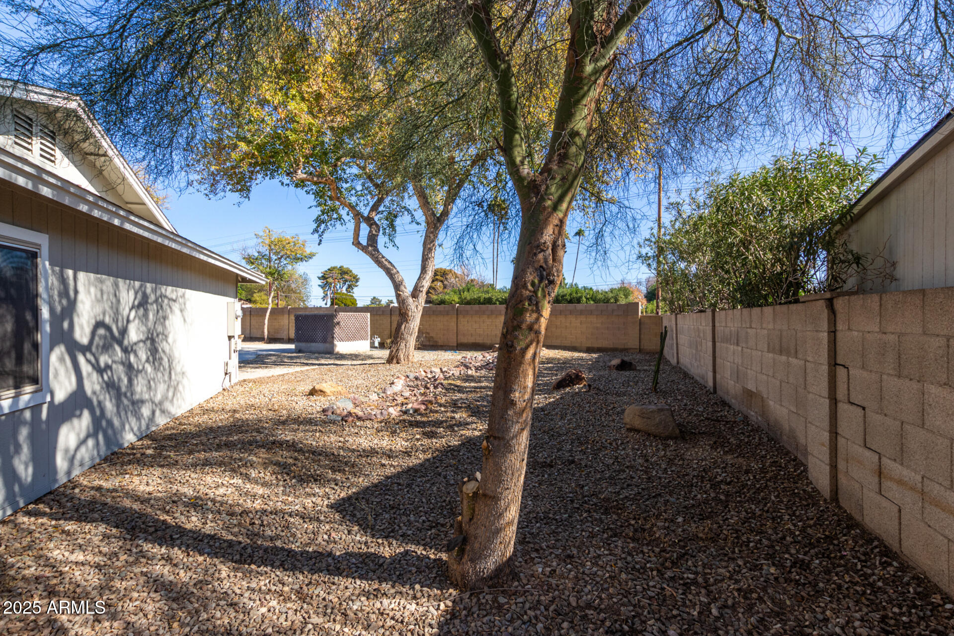 2201 South Evergreen Road Tempe, AZ 85282 - Photo 33 of 42 a view of backyard with wooden fence