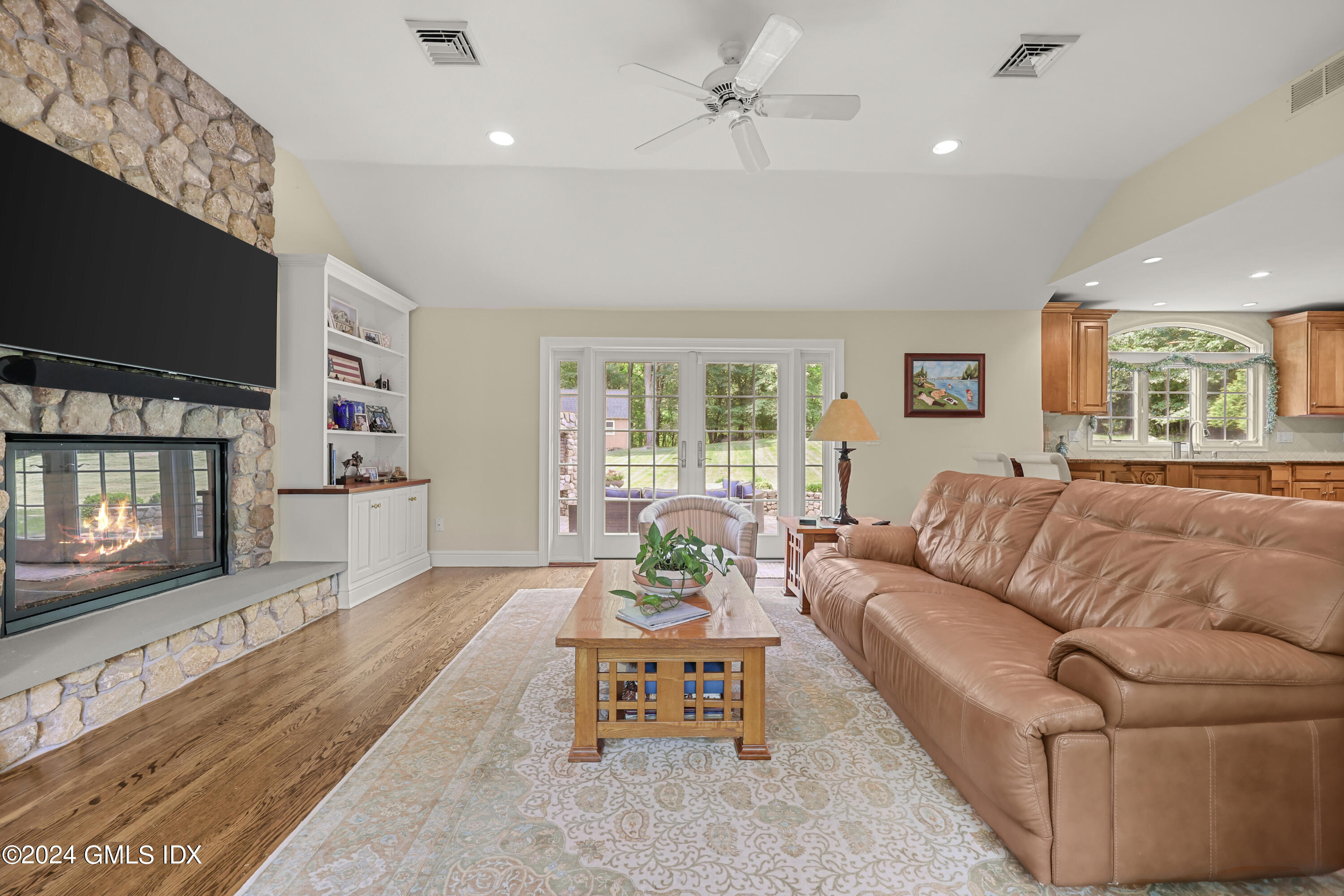 56 Flint Rock Road Stamford, CT 06903 - Photo 13 of 28 a living room with furniture and a flat screen tv