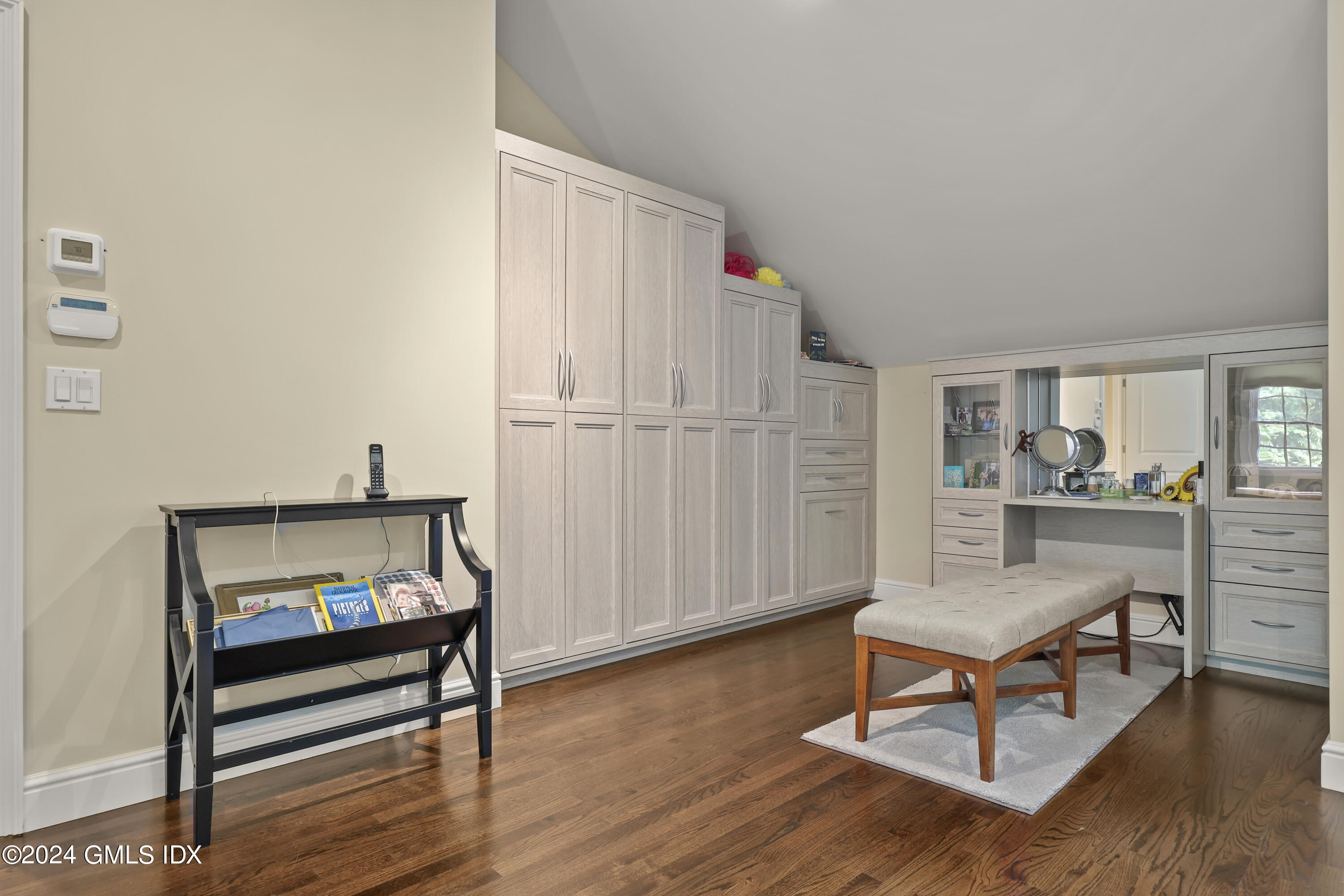 56 Flint Rock Road Stamford, CT 06903 - Photo 16 of 28 a living room with furniture a rug and a painting on the wall