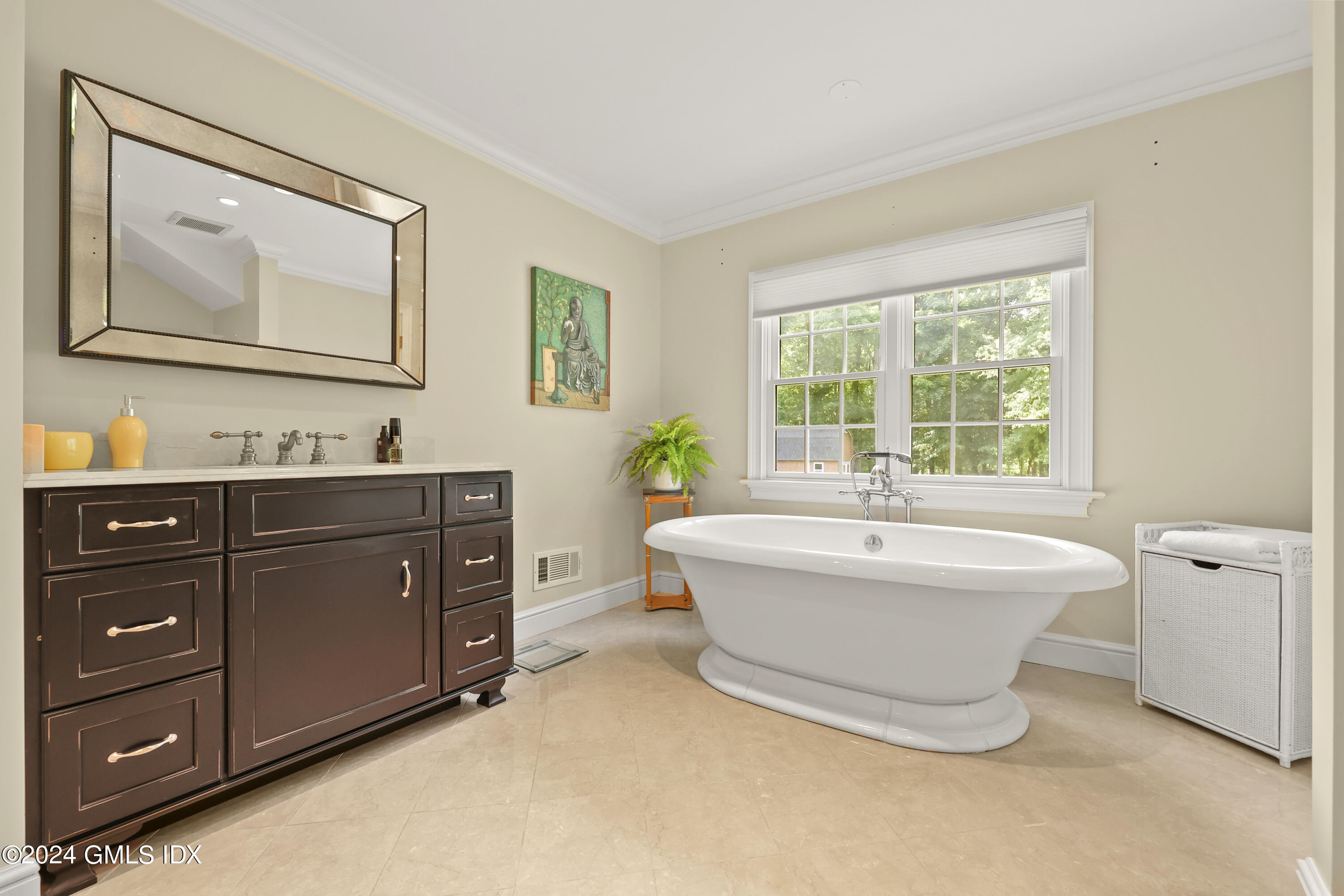56 Flint Rock Road Stamford, CT 06903 - Photo 17 of 28 a spacious bathroom with a double vanity sink a two mirror a window and a bathtub