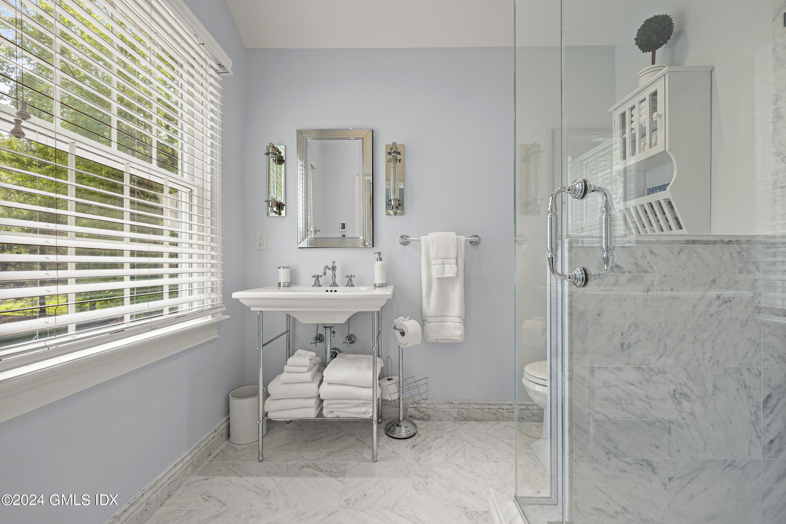 56 Flint Rock Road Stamford, CT 06903 - Photo 19 of 28 a bathroom with a sink and a mirror