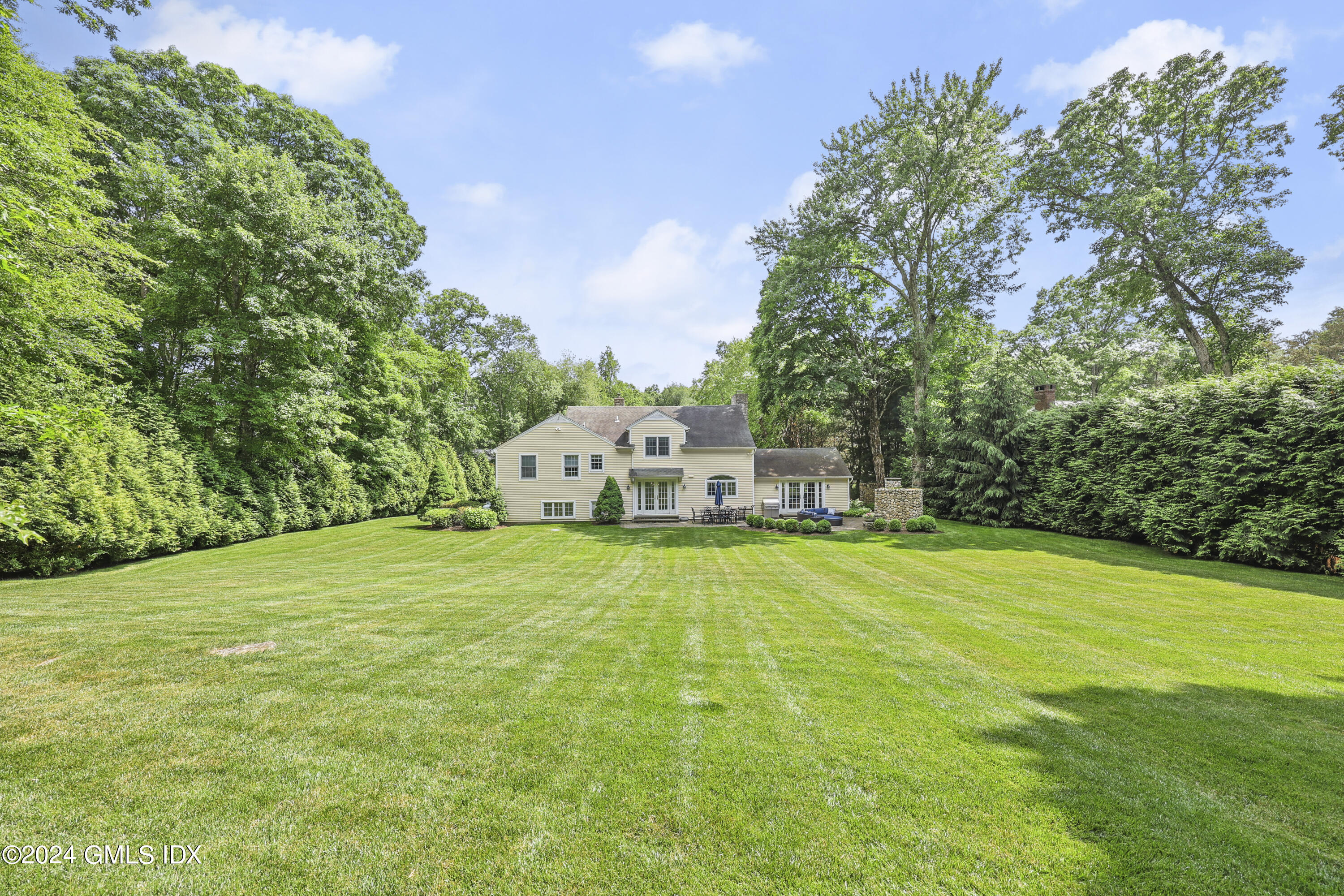 56 Flint Rock Road Stamford, CT 06903 - Photo 21 of 28 a house with a yard