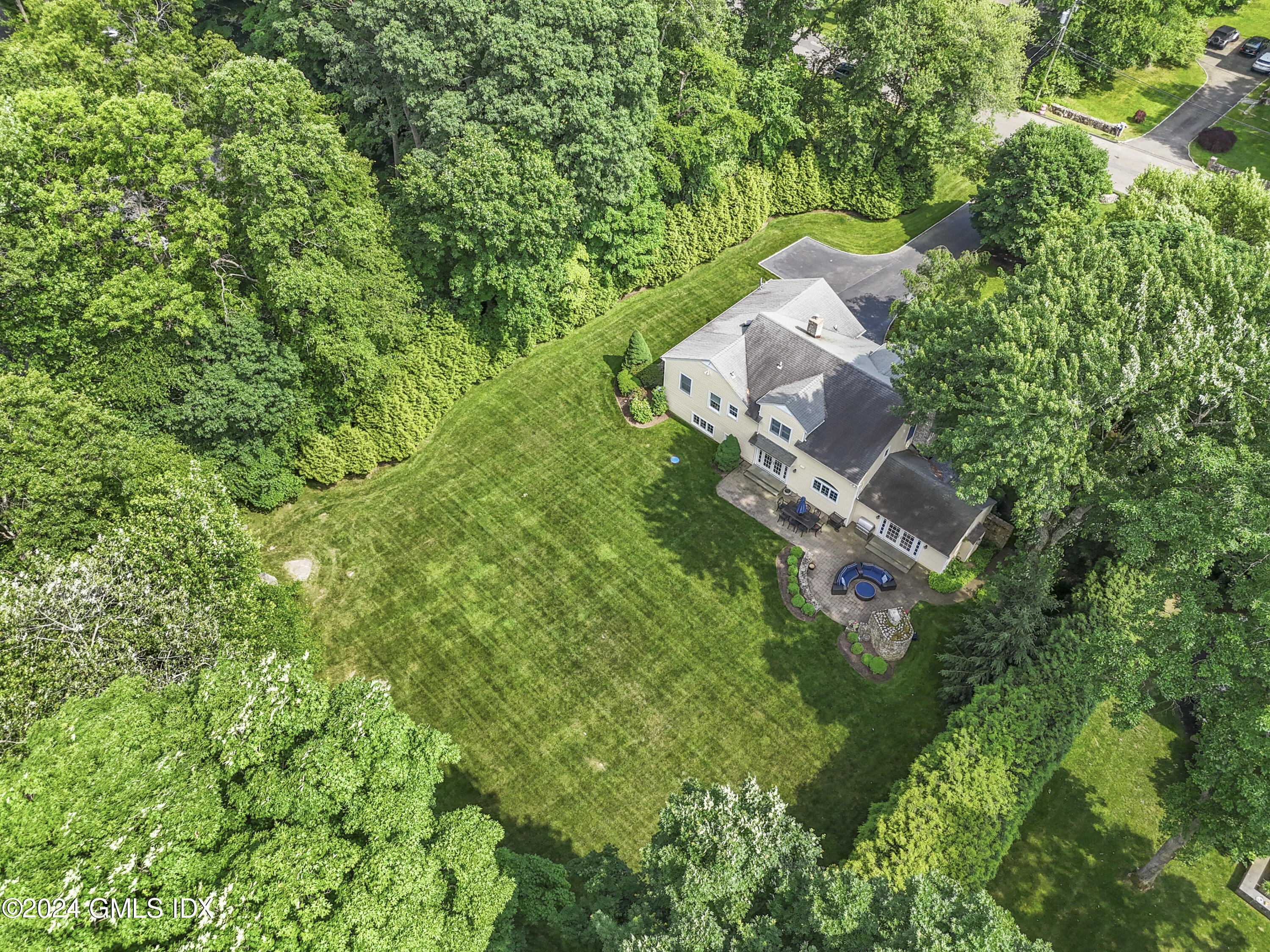 56 Flint Rock Road Stamford, CT 06903 - Photo 24 of 28 an aerial view of a house with a yard