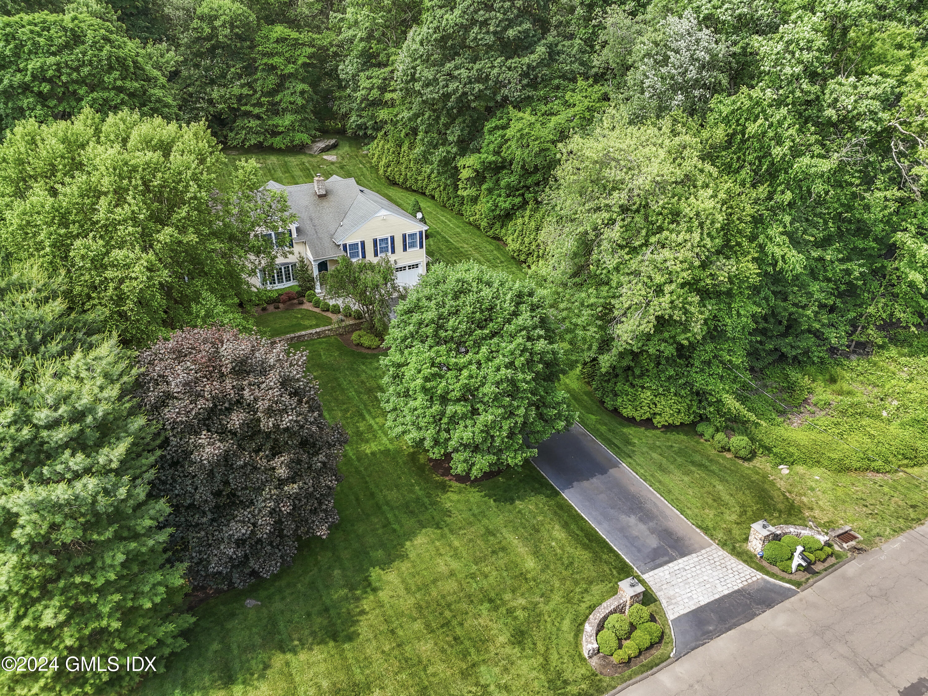 56 Flint Rock Road Stamford, CT 06903 - Photo 3 of 28 a house view with a garden
