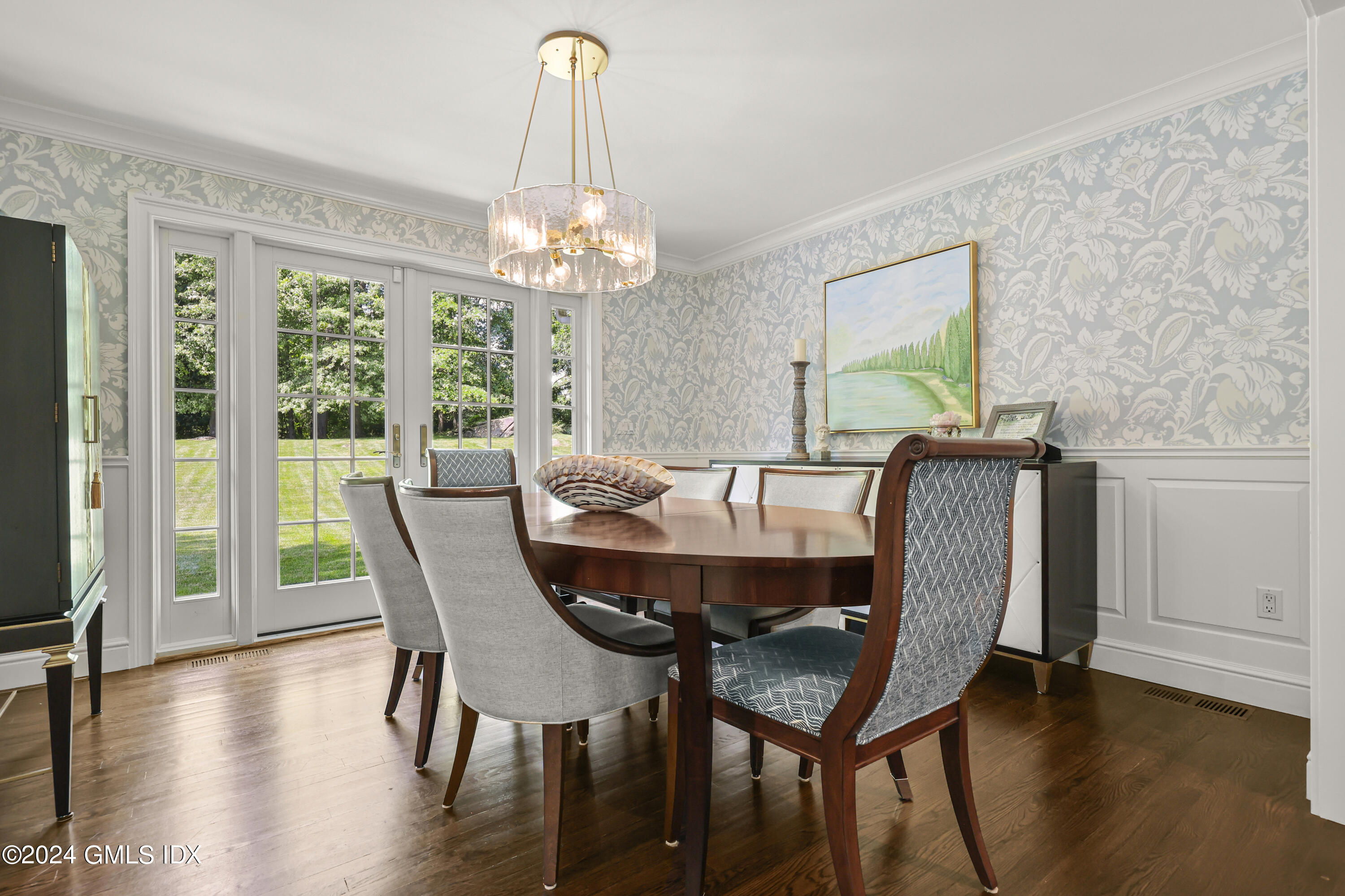 56 Flint Rock Road Stamford, CT 06903 - Photo 8 of 28 a view of a dining room with furniture a chandelier and wooden floor