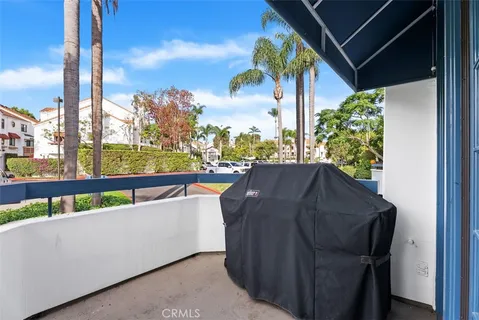 a view of balcony with furniture