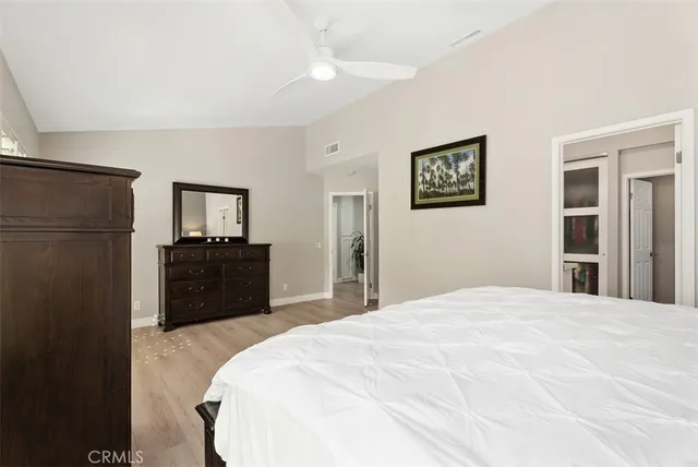 a large bed in a white room