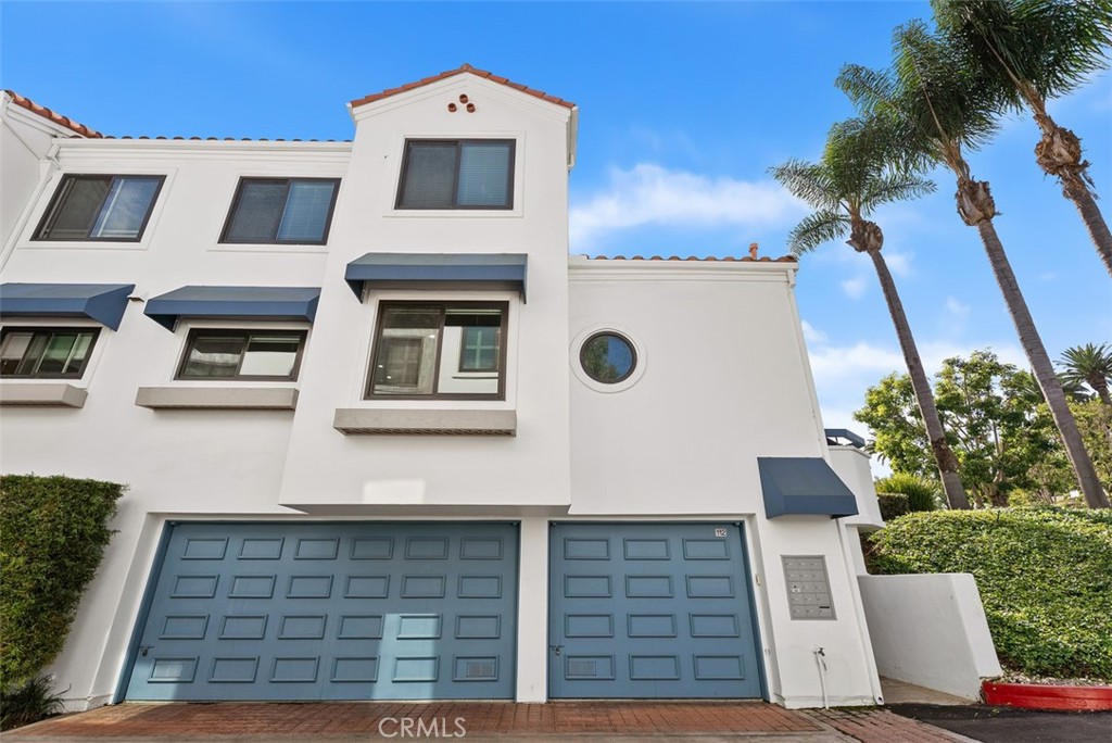 19502 Ranch Lane, Unit 112 Huntington Beach, CA 92648 - Photo 34 of 45 front view of a house with a yard