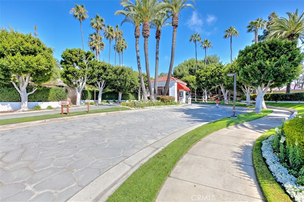 19502 Ranch Lane, Unit 112 Huntington Beach, CA 92648 - Photo 38 of 45 a view of a swimming pool with palm trees