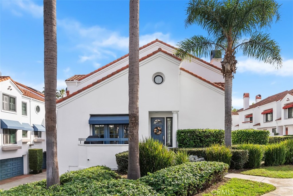 19502 Ranch Lane, Unit 112 Huntington Beach, CA 92648 - Photo 44 of 45 a front view of a house with garden