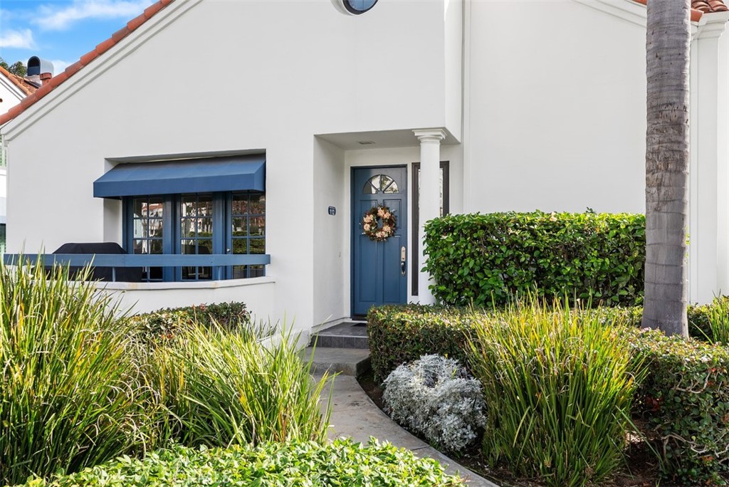 19502 Ranch Lane, Unit 112 Huntington Beach, CA 92648 - Photo 45 of 45 a front view of a house with a yard