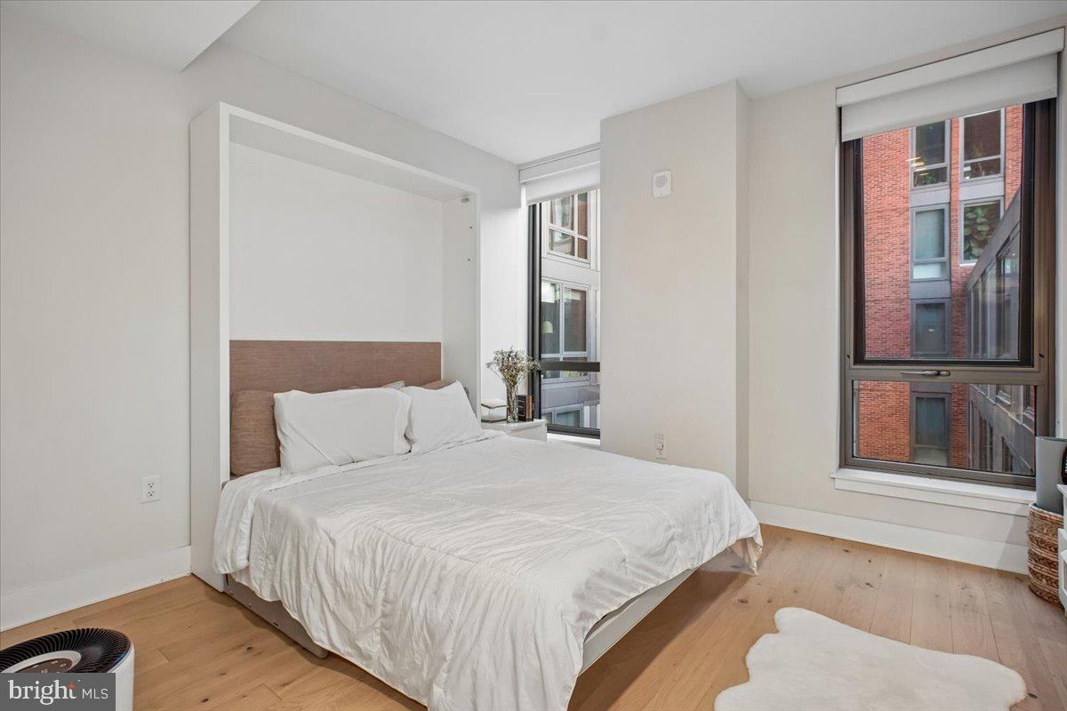 1211 Van Street Southeast, Unit 403 Washington, DC 20003 - Photo 13 of 21 a bedroom with a bed and a window
