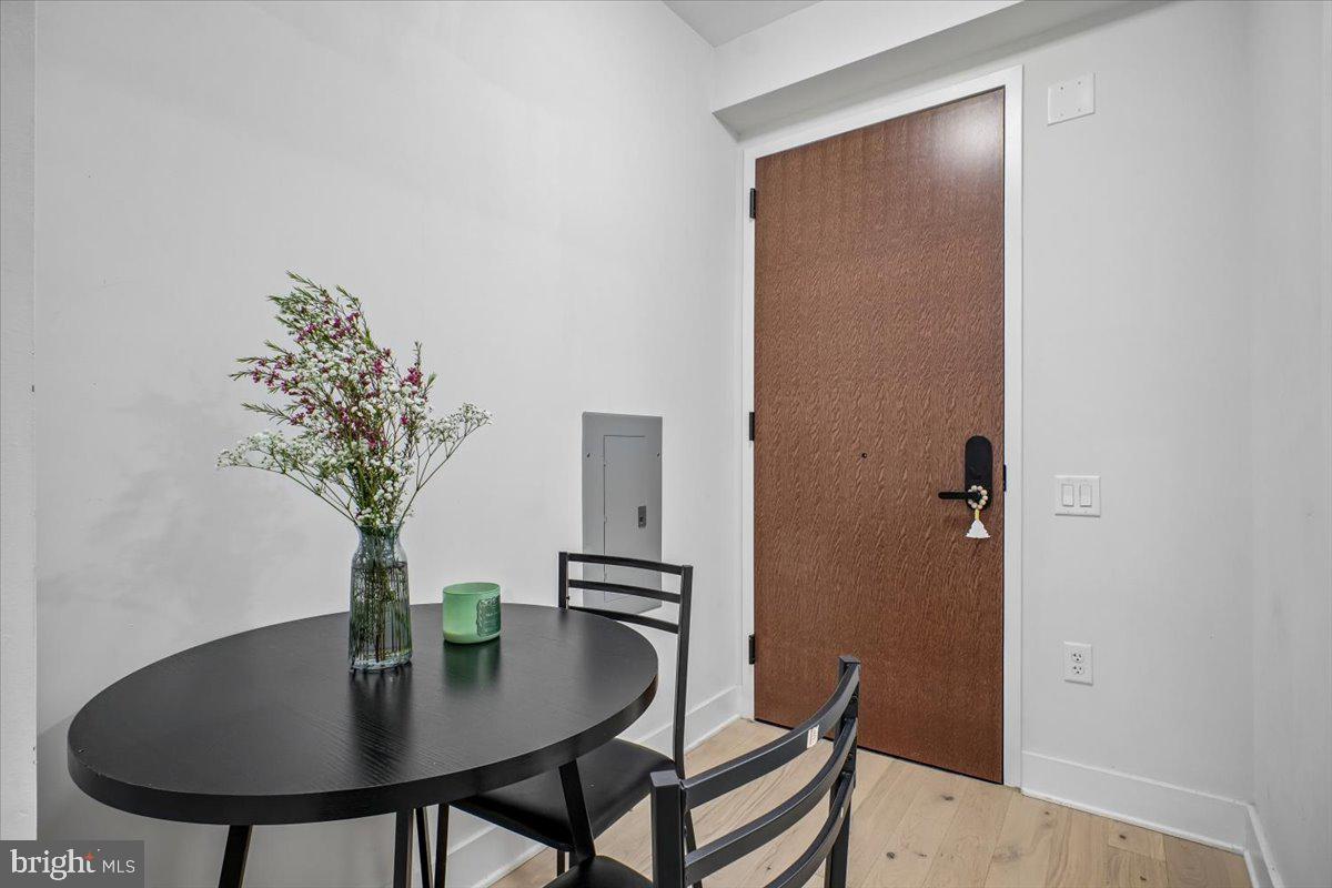 1211 Van Street Southeast, Unit 403 Washington, DC 20003 - Photo 2 of 21 a view of a room with a table and chairs