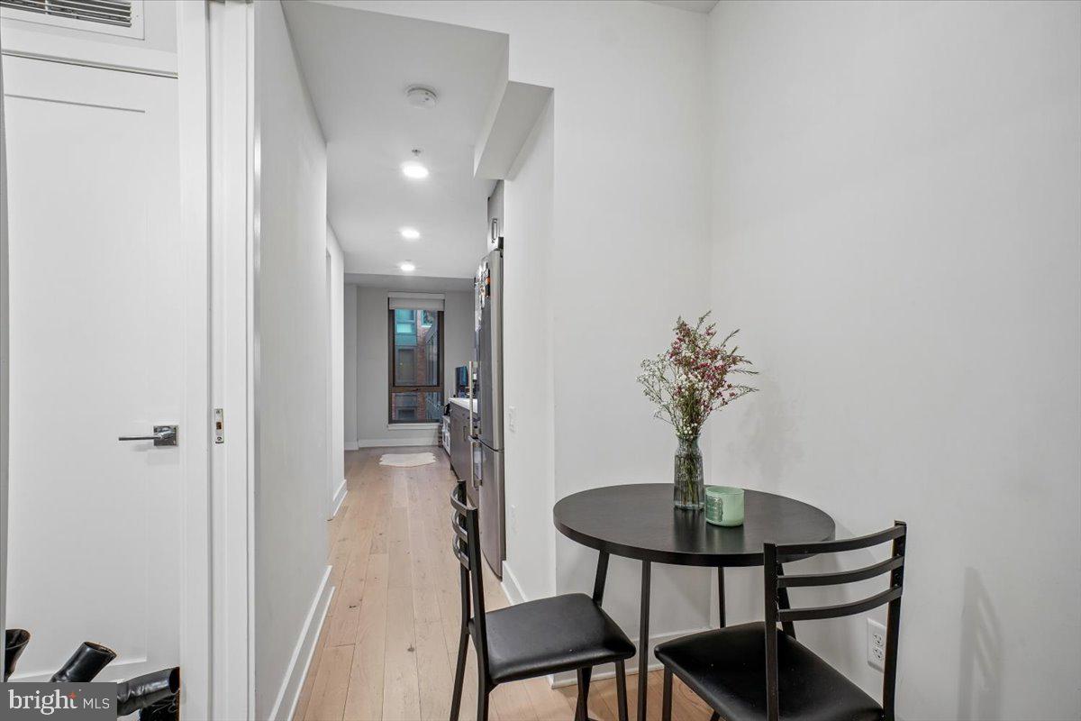 1211 Van Street Southeast, Unit 403 Washington, DC 20003 - Photo 3 of 21 a view of a livingroom with table and chairs