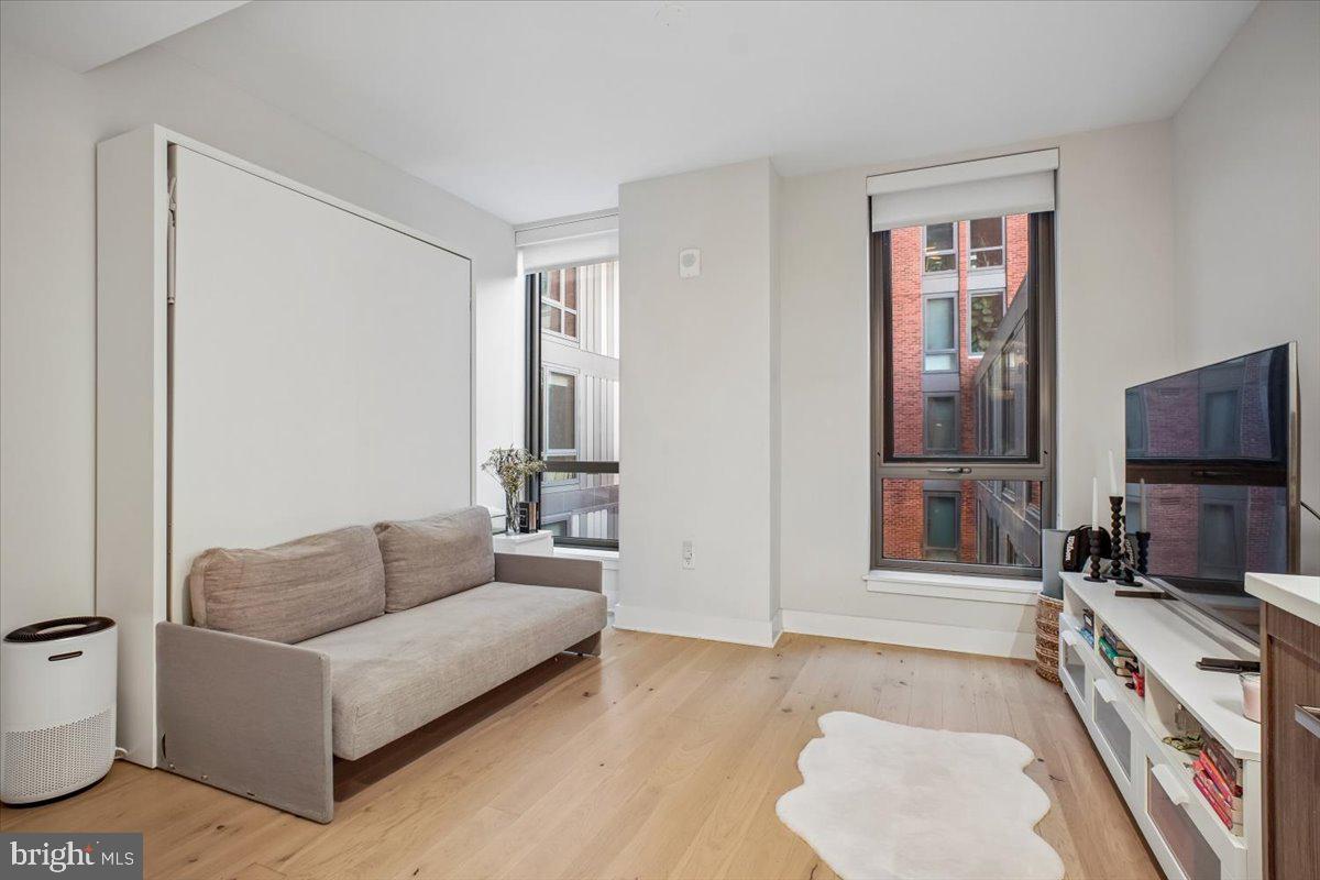 1211 Van Street Southeast, Unit 403 Washington, DC 20003 - Photo 9 of 21 a living room with furniture and a flat screen tv