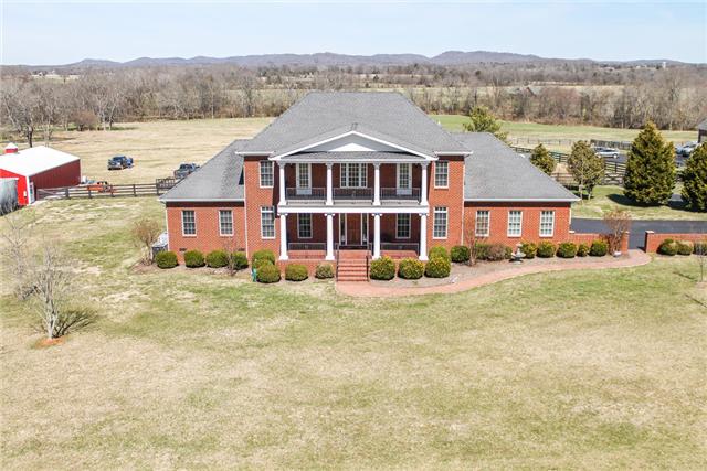 6288 Arno Road Franklin, TN 37064 - Photo 1 of 20 a front view of a house with a yard and mountain view in back