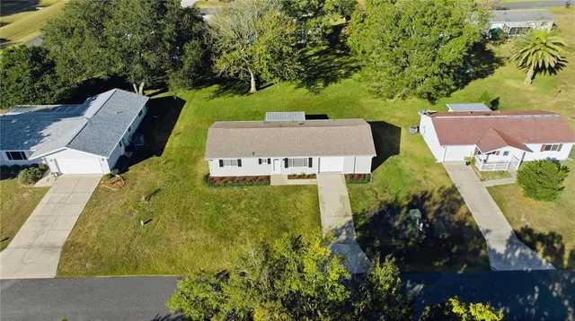 an aerial view of a house with a garden