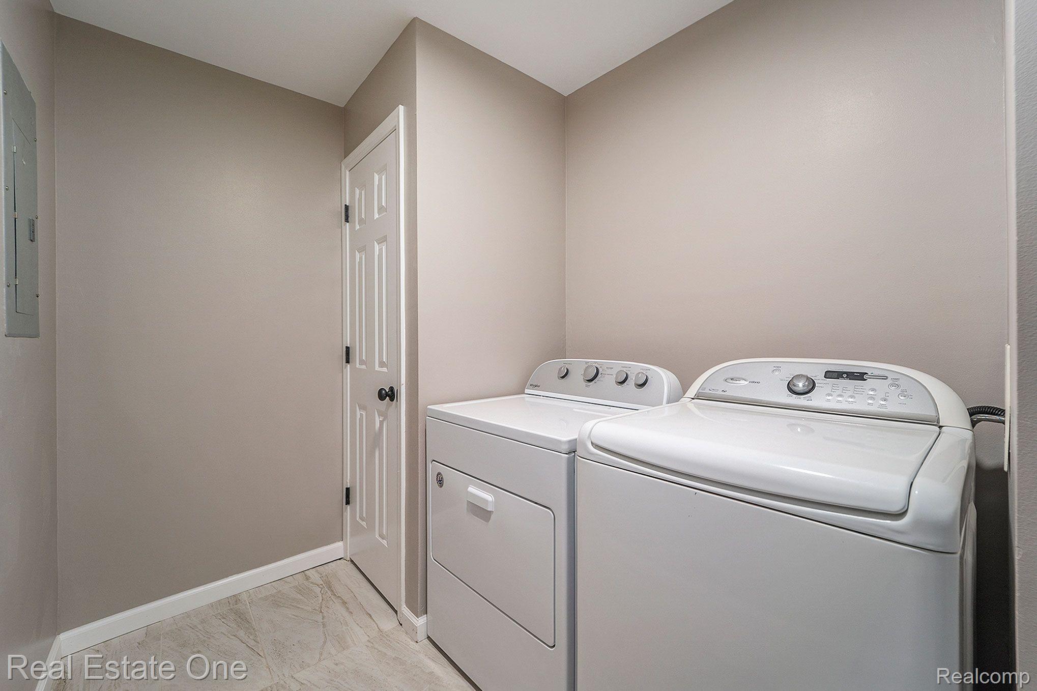 4240 East Commerce Road Commerce Township, MI 48382 - Photo 17 of 27 First-Floor Laundry Room