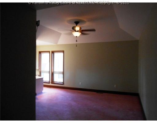 274 Sage Lane Ripley, WV 25271 - Photo 13 of 16 Master Bedroom. Main floor master has tray ceiling, walk-in closet, dressing area/built-in vanity, luxury bath with shower, jetted tub, his-and-her sinks; door out to private deck!