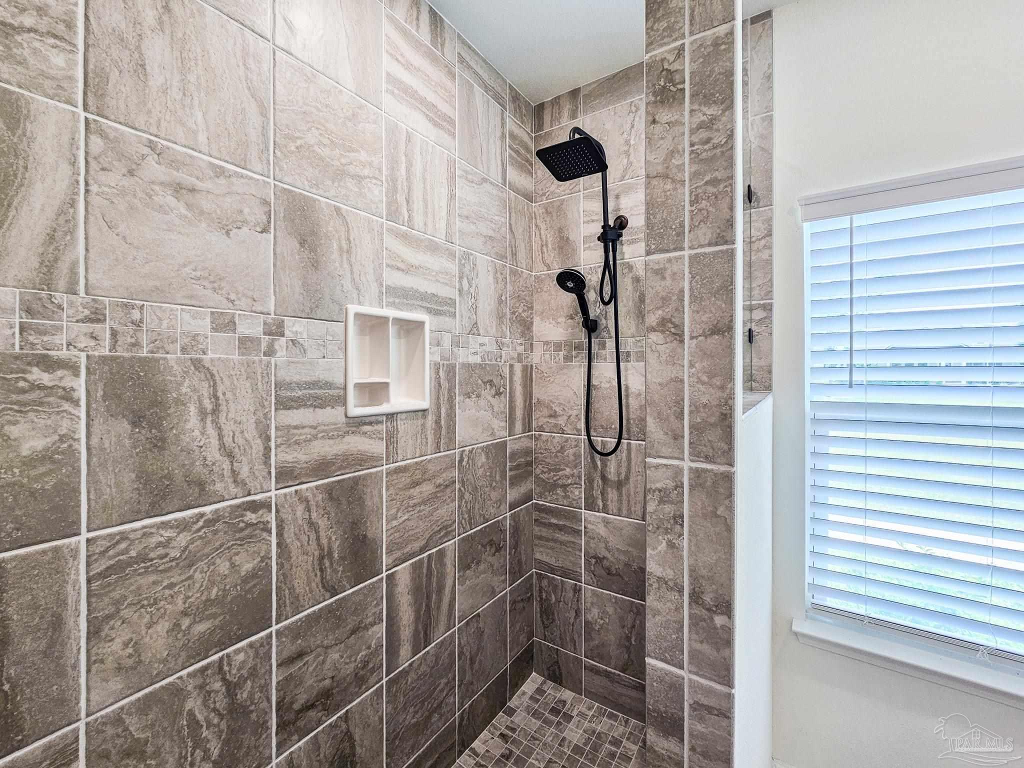 4149 Upper Walk Lane Milton, FL 32583 - Photo 14 of 43 a bathroom with a shower