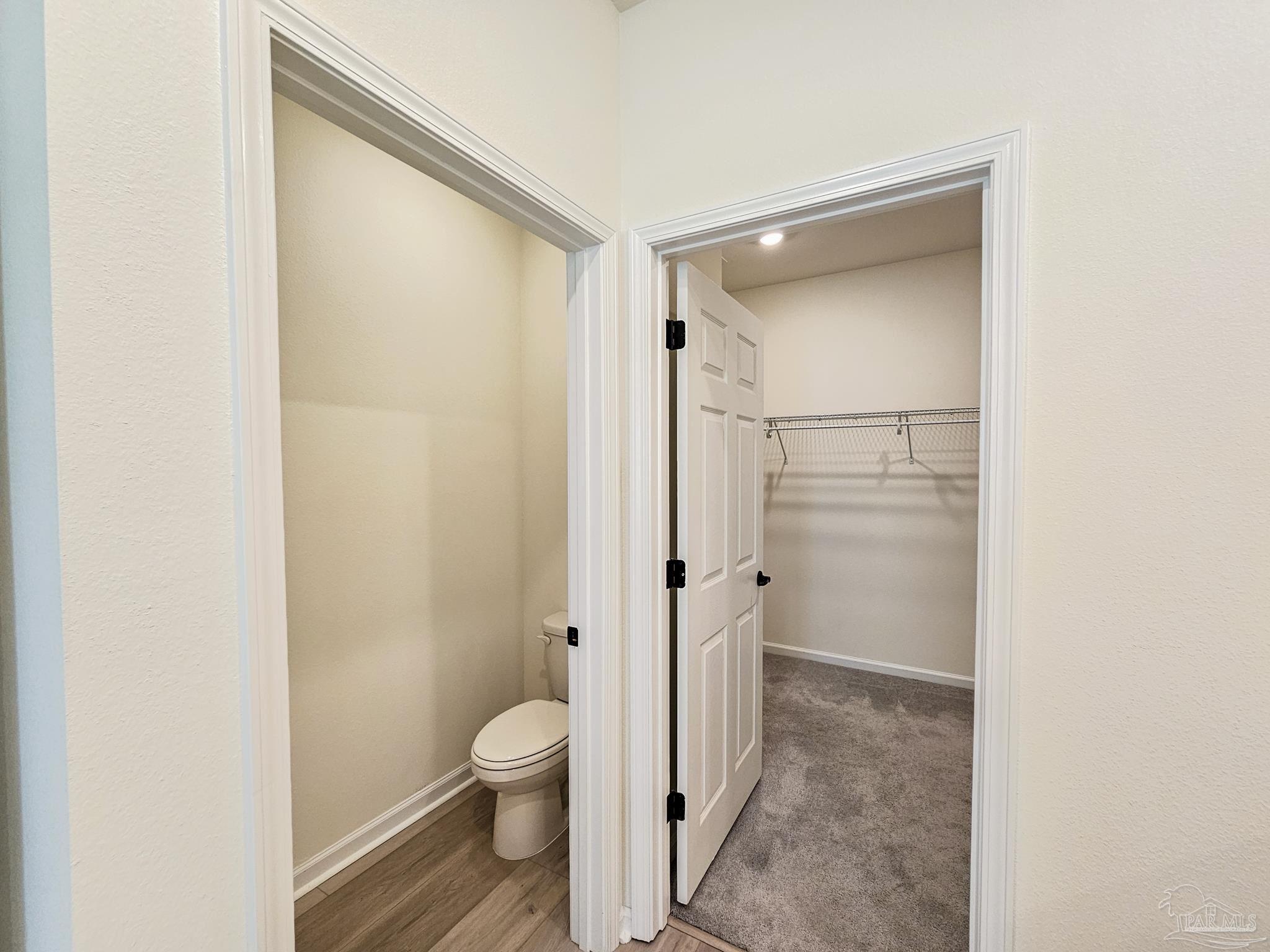 4149 Upper Walk Lane Milton, FL 32583 - Photo 17 of 43 a bathroom with a granite countertop toilet and a shower