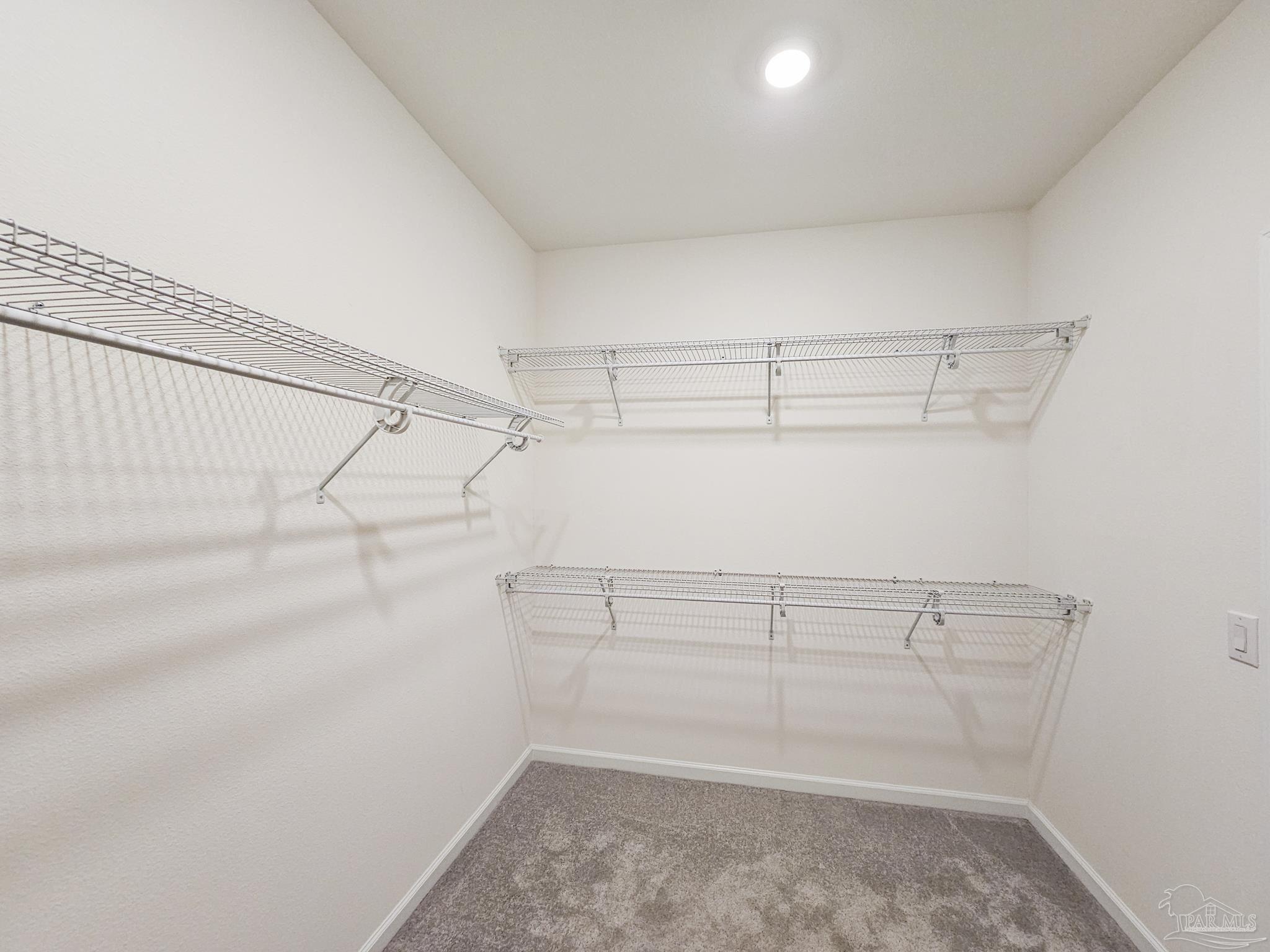 4149 Upper Walk Lane Milton, FL 32583 - Photo 19 of 43 a view of storage and utility room with racks on the wall