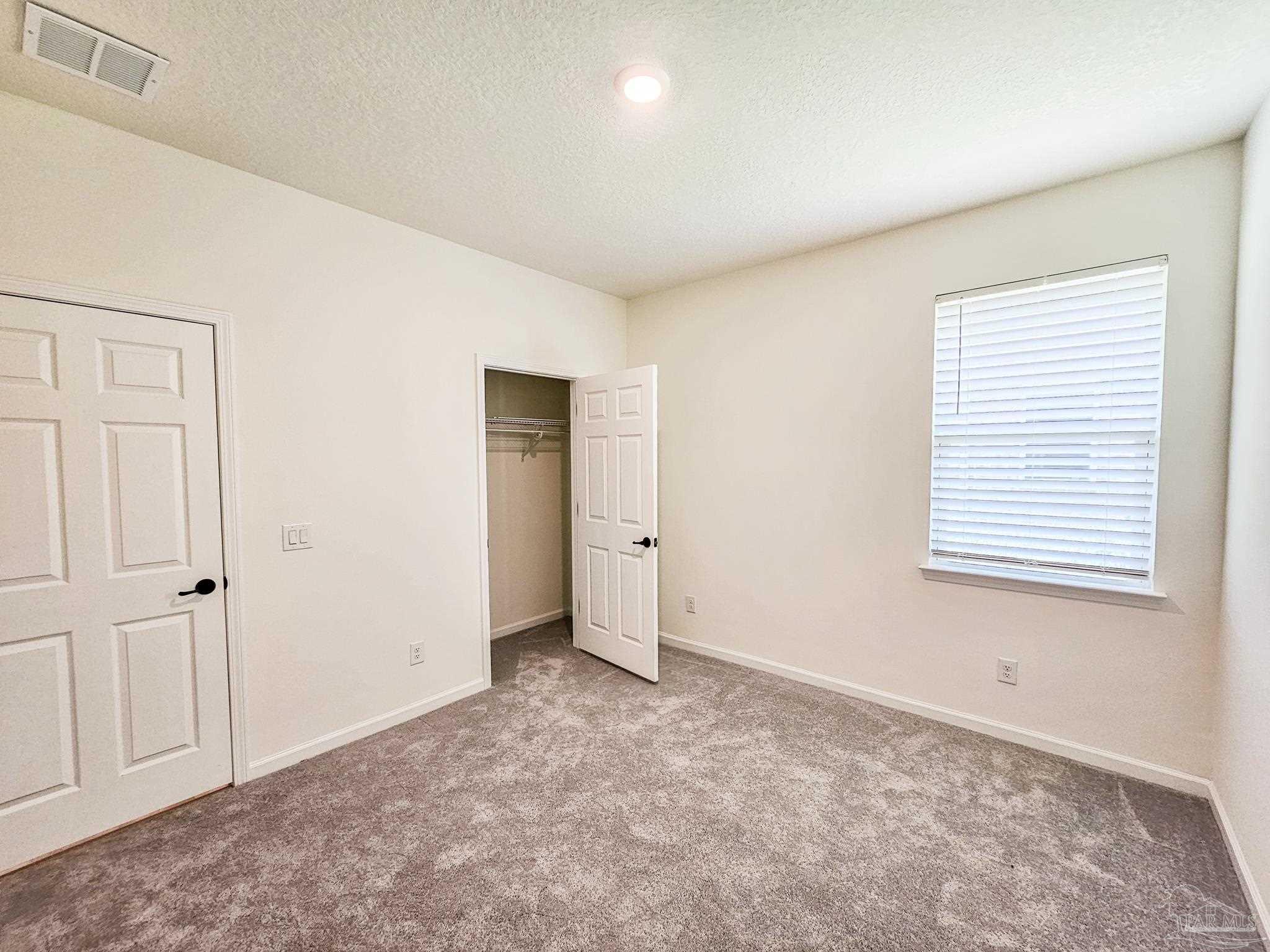 4149 Upper Walk Lane Milton, FL 32583 - Photo 24 of 43 an empty room with a window