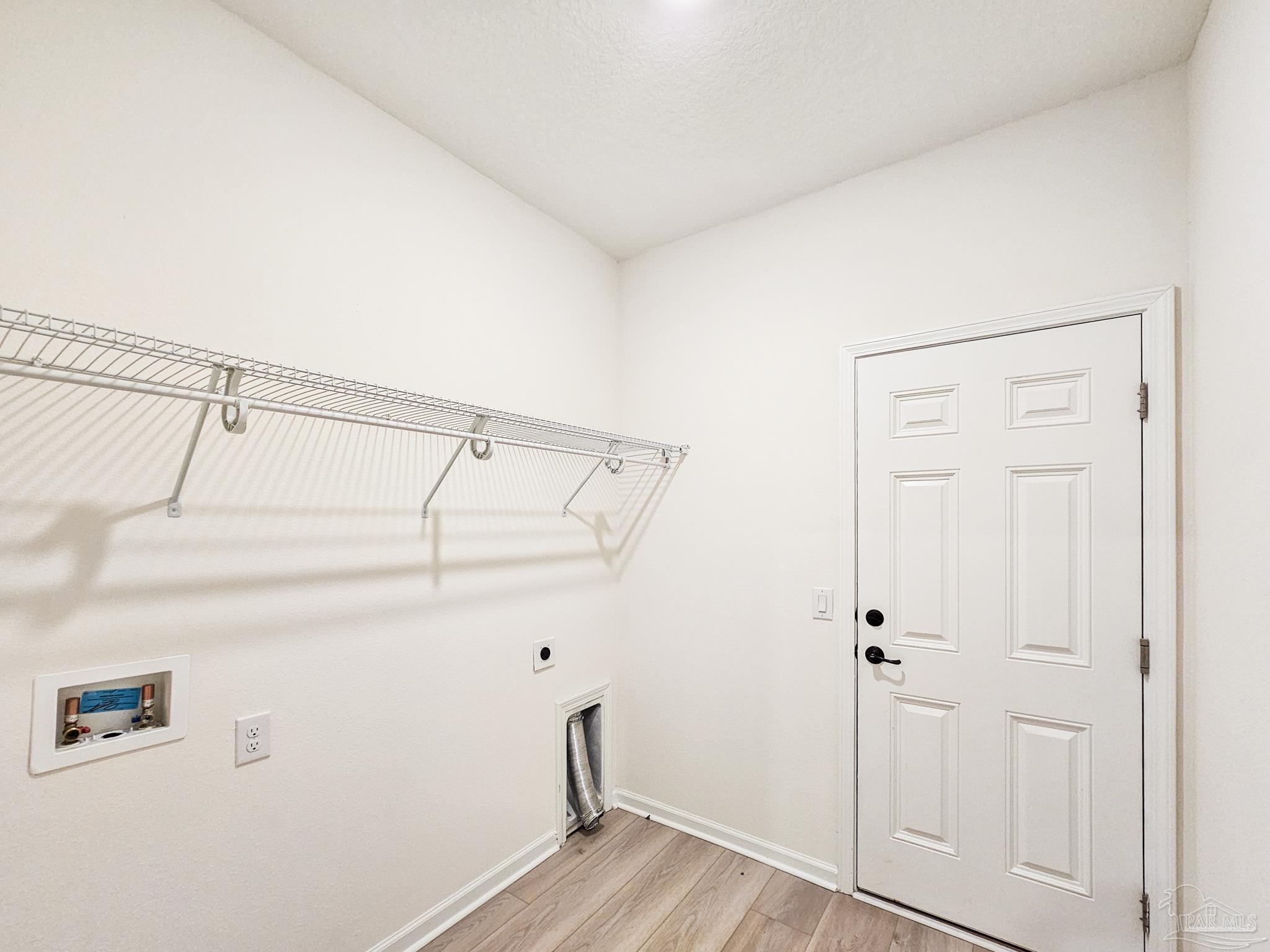 4149 Upper Walk Lane Milton, FL 32583 - Photo 32 of 43 a view of walk in closet with empty racks