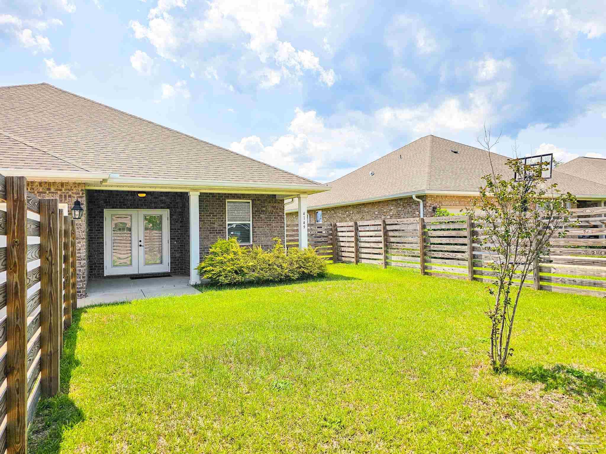 4149 Upper Walk Lane Milton, FL 32583 - Photo 34 of 43 a view of an house with swimming pool and porch with furniture