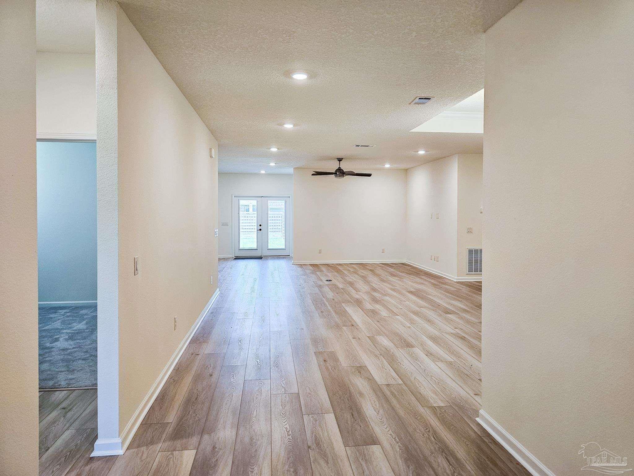 4149 Upper Walk Lane Milton, FL 32583 - Photo 4 of 43 a view of hallway with wooden floor