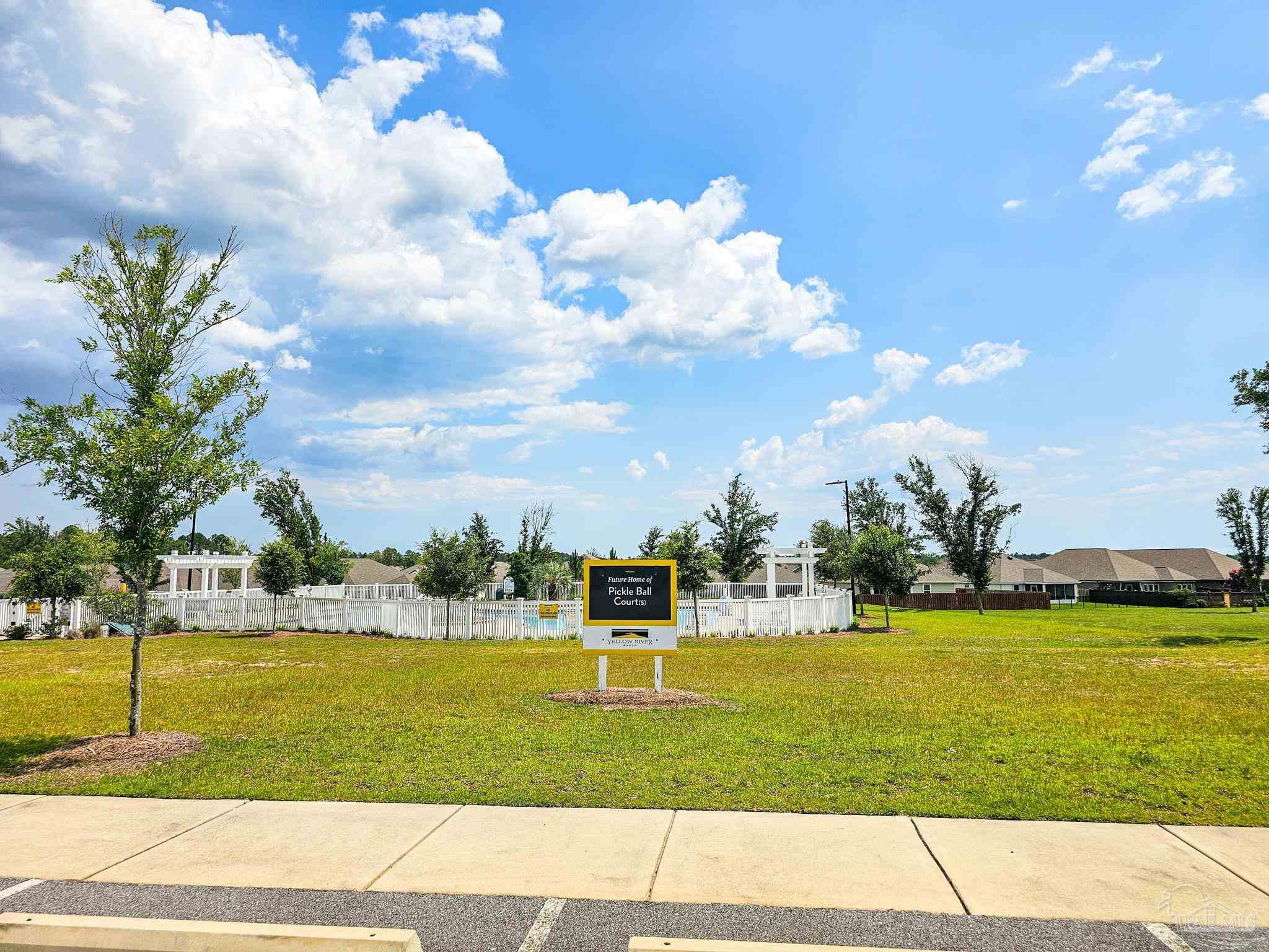 4149 Upper Walk Lane Milton, FL 32583 - Photo 43 of 43 a view of a fountain in front of a house with a big yard