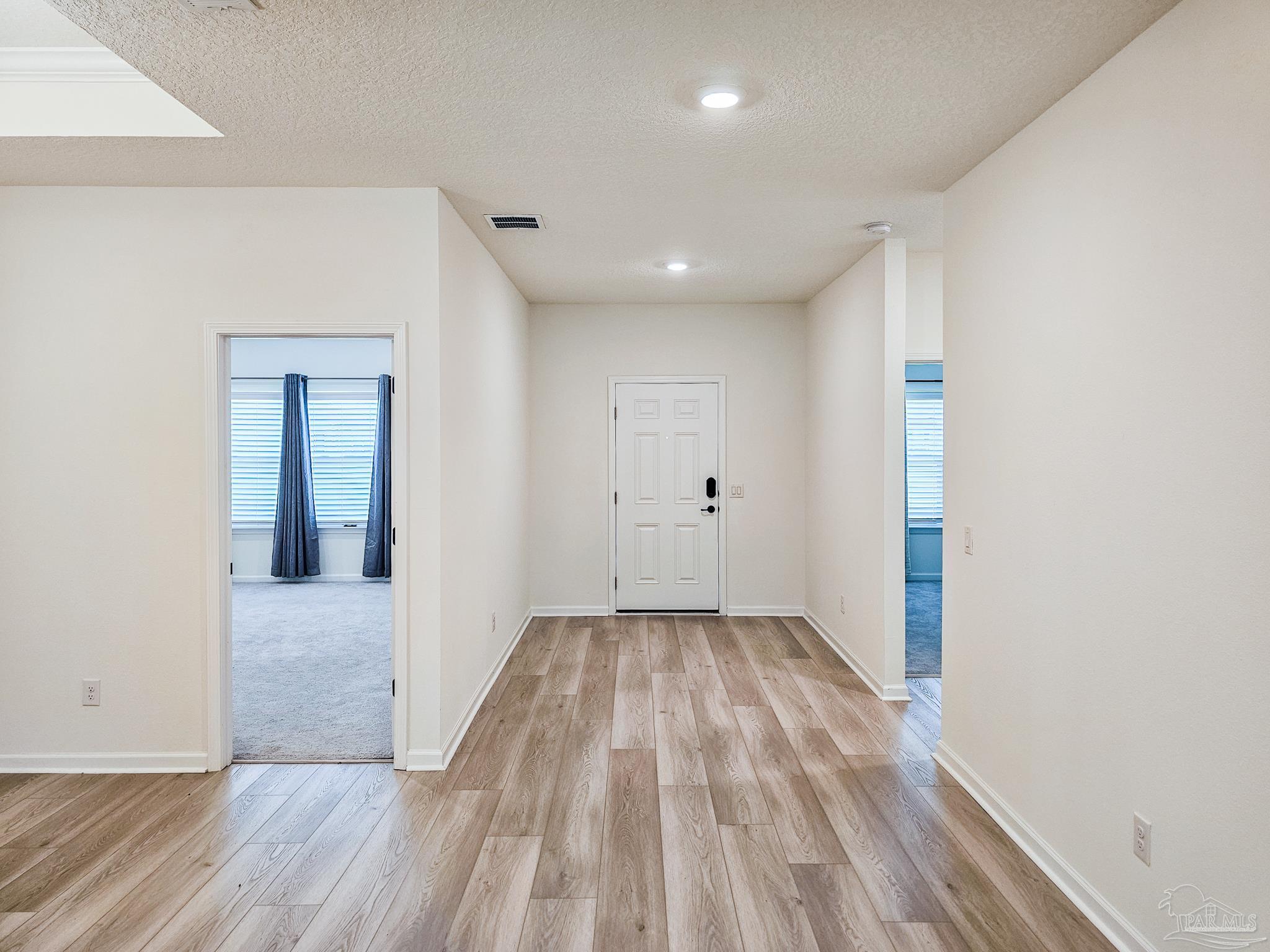 4149 Upper Walk Lane Milton, FL 32583 - Photo 5 of 43 a view of hallway with wooden floor